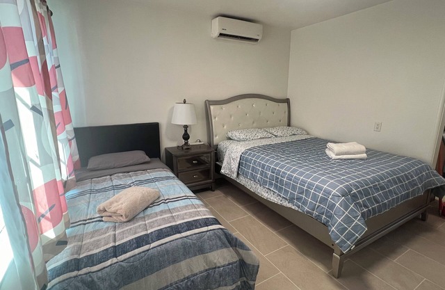 Mini single family house 2 bedrooms 1 bathroom with 3 beds.