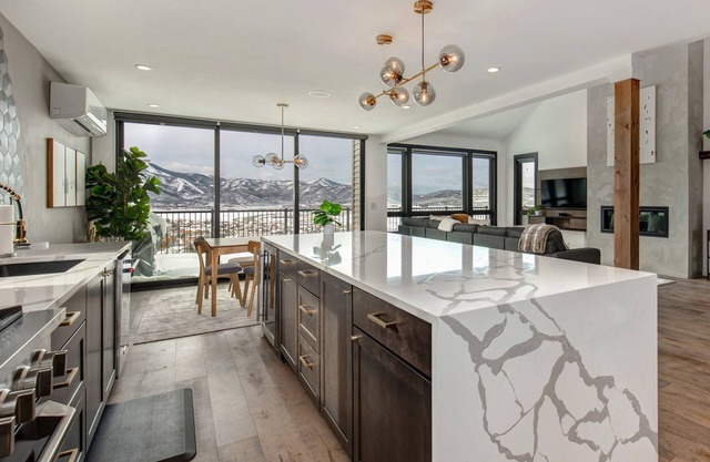 Modern, dog-friendly home with stunning mountain views, private hot tub, & grill