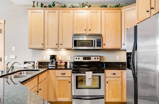 Modern, lake-view condo with loft, balcony, fireplace, pool & hot tub access