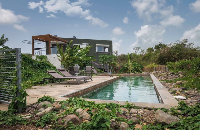 Panoramic view over sugarcane fields and Basse-Terre, absolute tranquility.