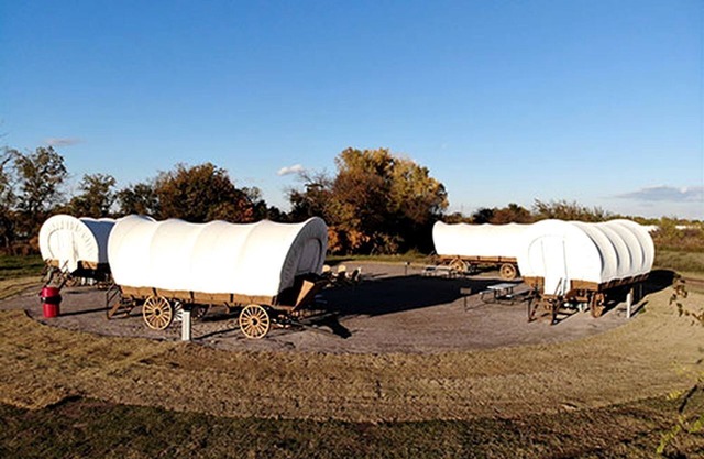 Perfect Glamping Vacations in this Rustic Conestoga Covered Wagon Rental in Oklahoma