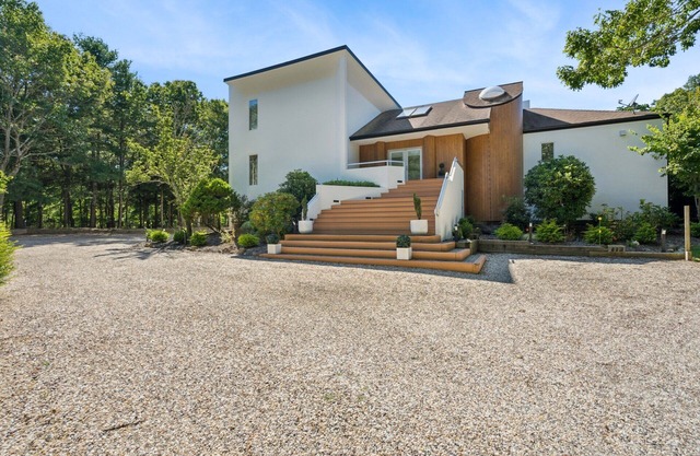 Private 2.1 acre gated home with heated pool and tennis & pickleball court