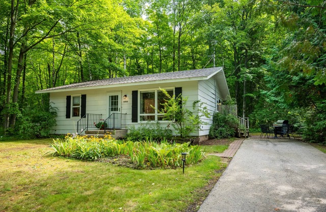 Retreat on a wooded lot within walking distance of downtown!