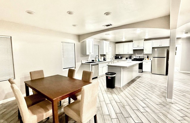 Spacious 4-bedroom house in charming Bakersfield with AC. 4 queen & 3 twin beds.