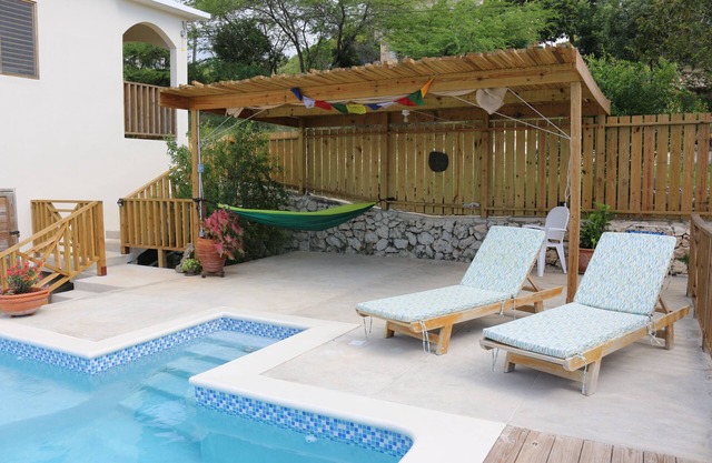 Spectacular views of the Caribbean Sea await you in this bright, airy home.