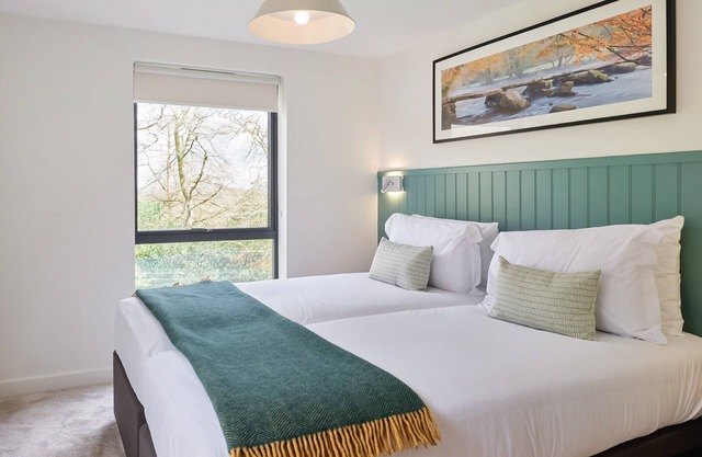 Spread across two floors, this inviting 2-bedroom lodge promises a comfortable retreat for up to 4 g