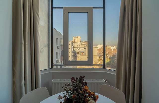 Top-Floor Romanian Athenae 2BR Apartment, Quiet City Views