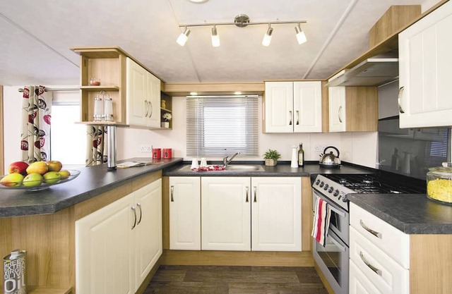 Top of the range 12ft-wide caravan with one double and two twin.