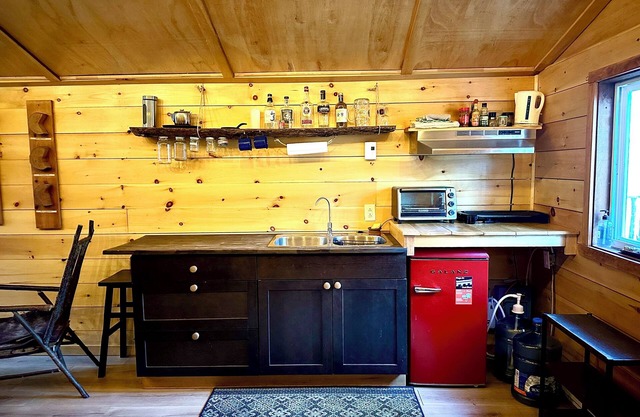 Unique cabin perched high with white pine trees