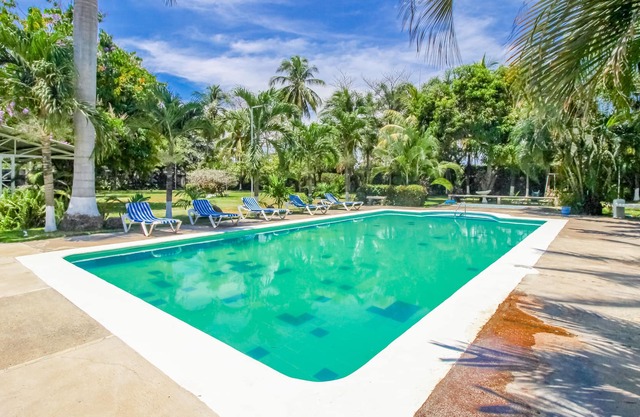 Villa with terrace, shared pool & community gardens - walk to beach!