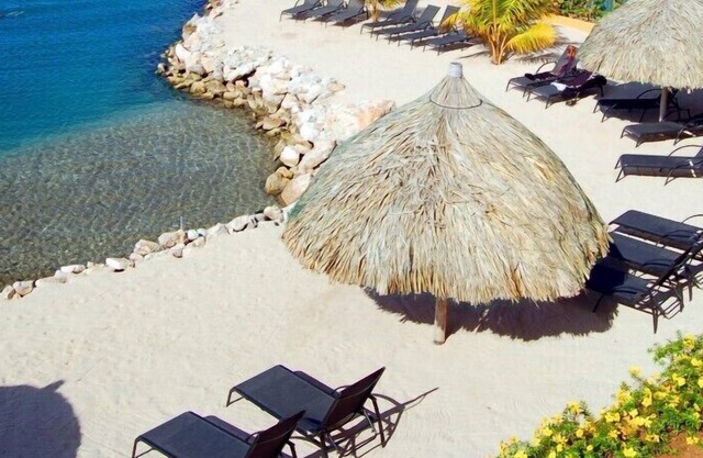 Walk onto the beach and downtown from your luxurious family condo