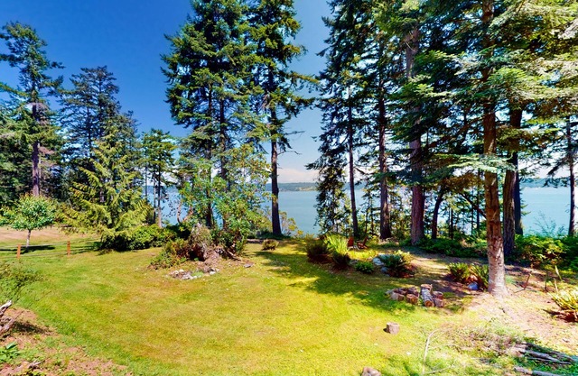 Water-view home with large deck, firepit, grill, & W/D