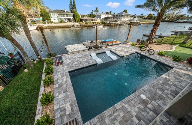 Waterfront home w/direct gulf access + pool + hot tub + activites!