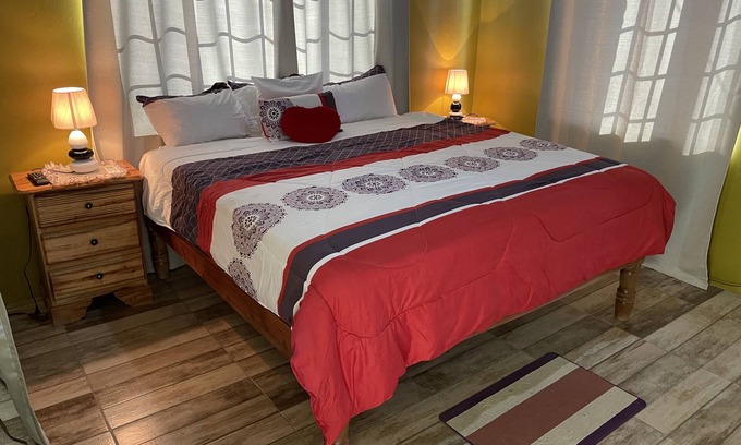 Negril House | 1 King bed, cable tv , wifi mini fridge stocked with welcome beer