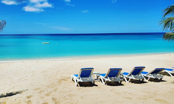 West Bay Condo | 7 Mile Beach Private Beach Club. Ocean views from Roof Terrace and Pool Pavilion