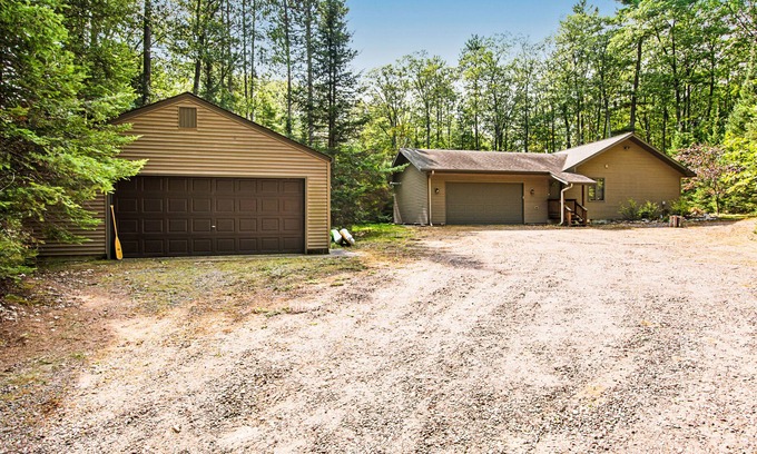 Sayner House | All-seasons home with walking trails, sledding hill, firepit, fireplaces & deck