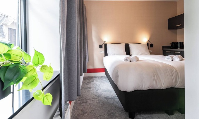 Centrum Apartment | Artist-inspired suite for 2 with king bed, private kitchen, air conditioning, and all modern comforts. Perfect for couples or solo travelers.