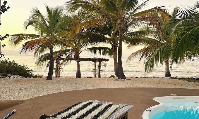 West End Apartment | Beachfront 2-bdr 2-bath "Sunshine Aloha Suite" 100 ft from the Ocean with Pool!