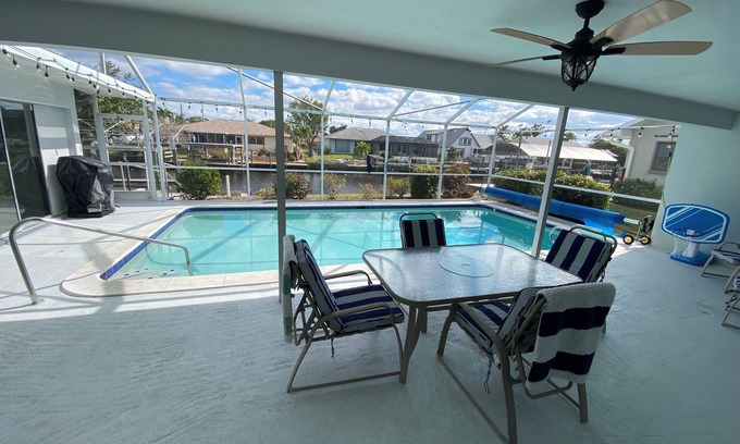 Lochmoor Waterway Estates House | Beautiful Waterfront Home with Heated Pool in Quiet Neighborhood