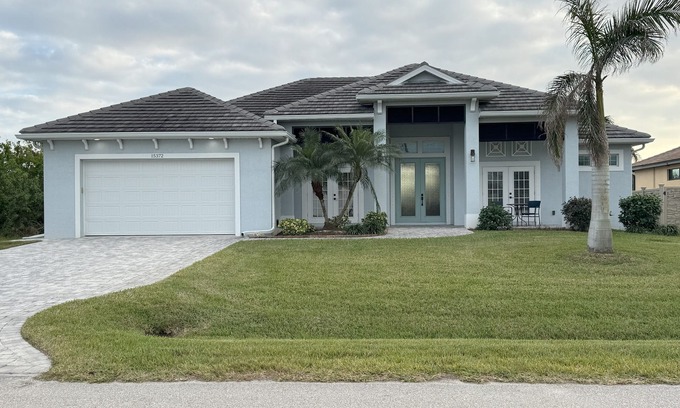 South Gulf Cove House | Bela-Vita-Charming 3-bedroom canal front pool home with 2 master suites