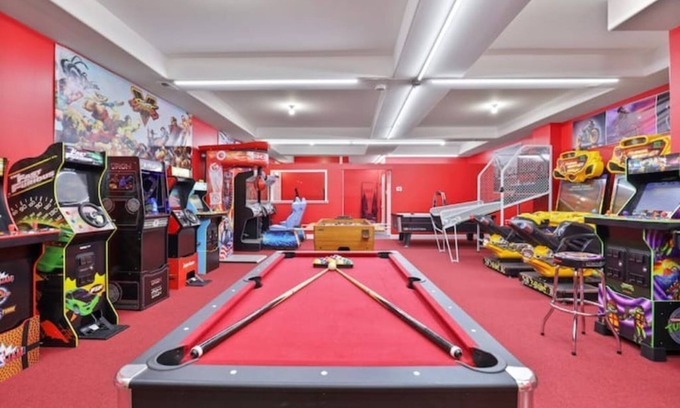 Belmont Cragin Apartment | Belmont Pleasures - hot tub/arcade gaming room