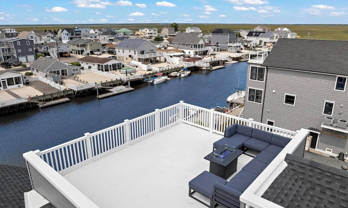 Mystic Island House | Brand New, Waterfront Beach Oasis with Heated Pool, Hot Tub, & Dock close to LBI