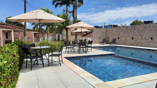 Pilar House | Casa 85 m2 no FORTE 2 quartos campinho piscinas 2 vagas no estacionamento portaria ar condicionado para 8 pessoas