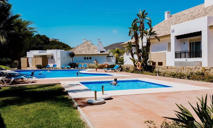 Mijas Ski Chalet | Chalet 'Comodo Triplex La Cala Golf' with Shared Pool, Wi-Fi and Air Conditioning