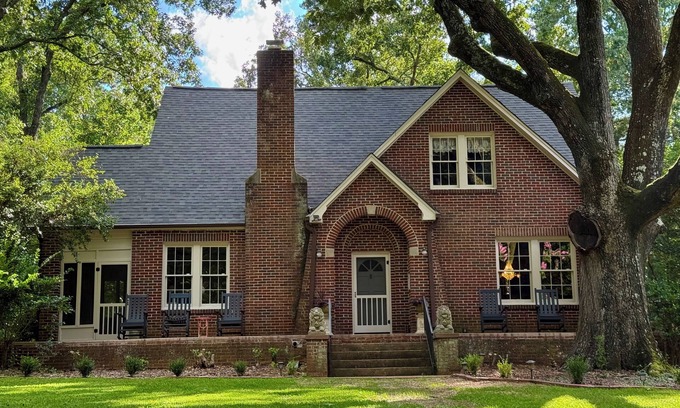 Steele Creek House | Charming 1930's English cottage with historic ambiance on three private acres