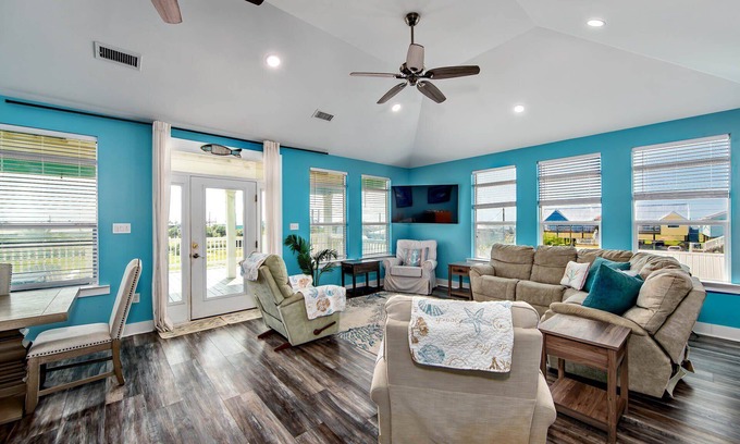 Grand Isle House | Coastal View: A charming 3-bedroom camp in Grand Isle, LA, across from the beach.