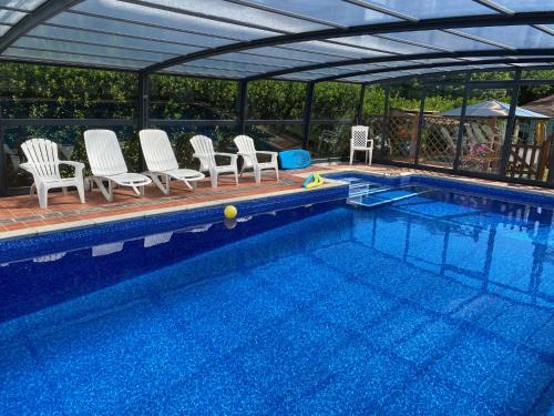 Portreath Apartment | Come and join us, 4 min walk to Beach, Pubs, Restaurants, Shops, Htd Pool, Hottub, Games rm, 1 acre Garden, BBQ, Stunning walks, Historic Bassets acre, 6 x 1-3 bedroom Superior aparts, Free Parking and WIFI