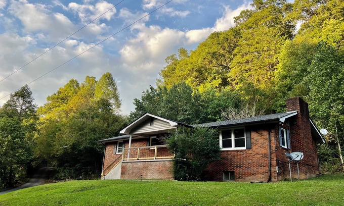 Newcomb House | Creekview retreat by ATV trails and waterfalls! Stunning creek view from porch.