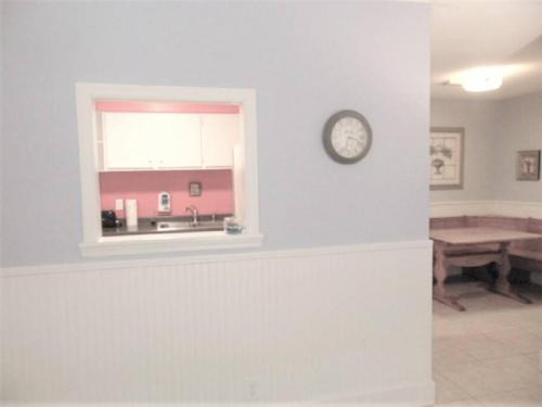 Demere Park House | D7 screened porch welcoming and cozy Downstairs neat and ready for your arrival