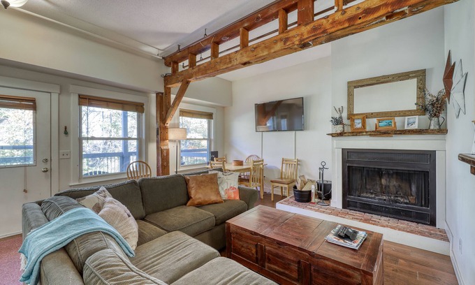 Ludlow Condo | Dog-friendly & riverfront condo one mile from Okemo with wood fireplace