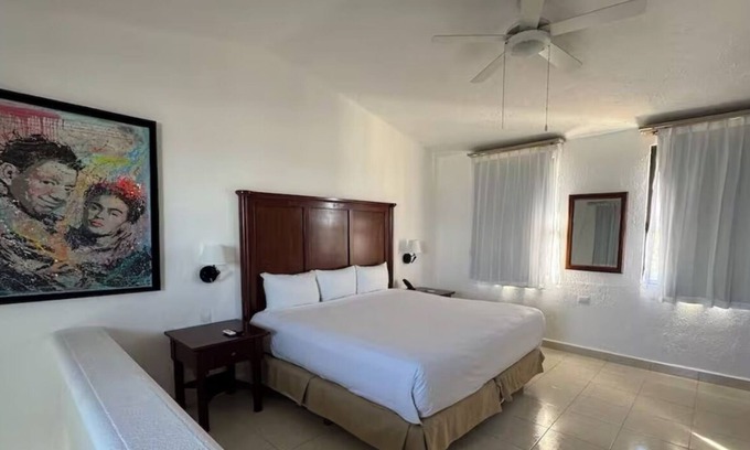 Puerto Juarez Resort | Duplex-Style Ocean View Studio with Balcony at Family Friendly Cancun Resort