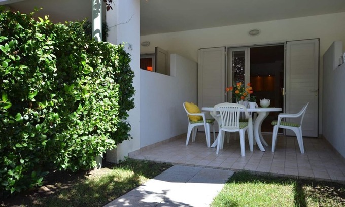 Bibione Pineda Apartment | Elegant fully equipped apartment with shared pool and garage