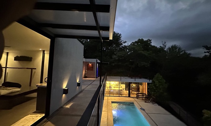 Santa Cruz House | Enjoy privacy and nature in this open concept home and relaxing pool. n