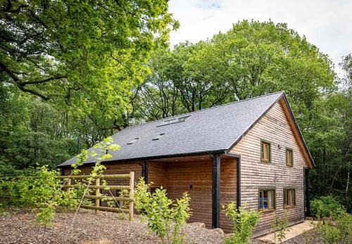 Farley House | Errwood, woodland lodge with hot tubs for 14