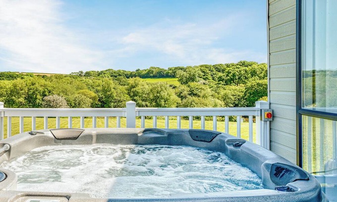 Hewas Water Ski Chalet | Escape to the Jasmine Lodge, nestled amidst stunning rolling countryside.