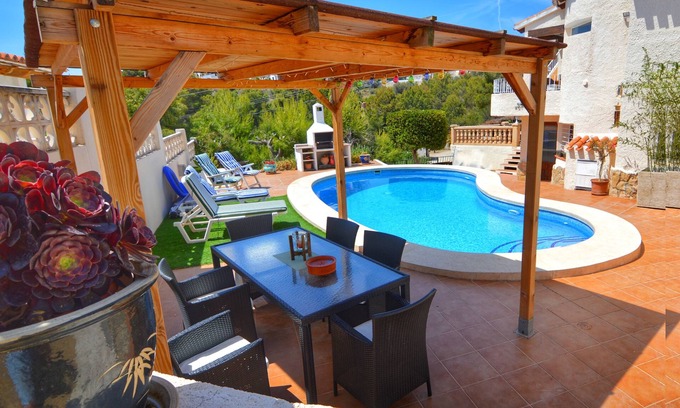 Pinar del Advocat Villa | Fiesta~Siesta in this easy to access Moraira home with unique bedrooms and BBQ