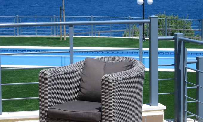Llanca Apartment | garden level apartment with full sea views in residence with swimming pool.
