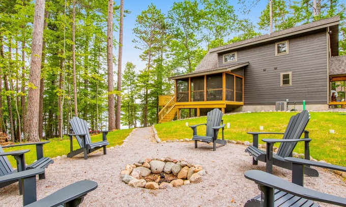 Eagle River House | Gorgeous lake home with private pier, beach, firepit, deck, & grill + water toys