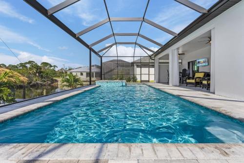 Burnt Store House | Gulf Access Home, Heated Saltwater Pool & Spa, Dock and Tiki Hut - Villa Perchside Palace