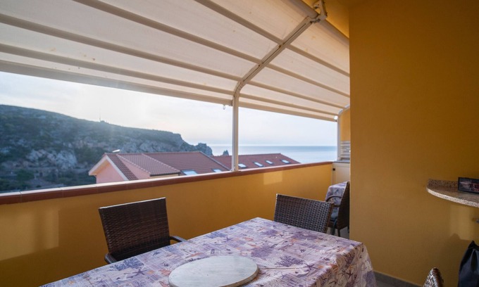 Buggerru House | Holiday Home 'Sole E Mare Buggerru - Appartamento' with Sea View, Private Terrace and Air Conditioning