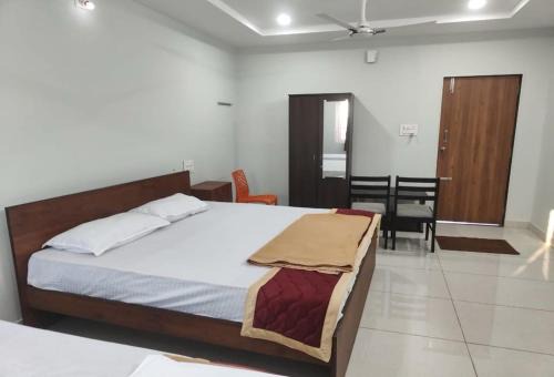 Nellore Hotel | Hotel O Mini Bypass Nellore Road Formerly AMR Guest Inn