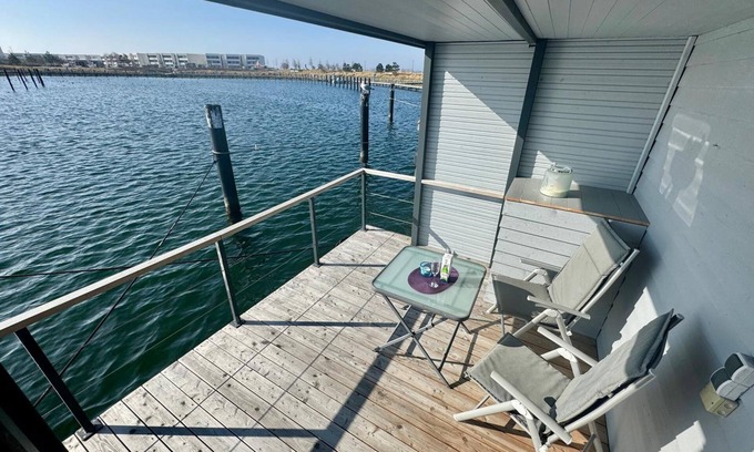 Ostholstein Boat Rental | House Boat 'Lilla Lina' with Sea View, Private Terrace and Wi-Fi