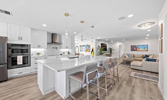 Tropic Palms House | Luxe Coastal Retreat - 4BR w/Pool, Hot Tub, Arcade & Work Space - 3 mi to beach