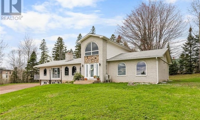 Moncton Villa | Modern Designer Villa Condo in Prime Location with Exclusive Amenities".