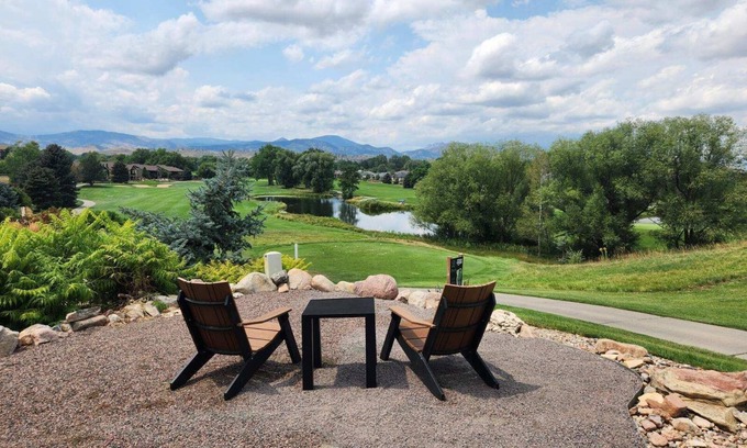 Loveland House | Nestled on the Marianna Butte Golf Course in Loveland, this modern garden-level basement retreat offers stunning mountain & lake views through large windows, flooding the space with light. Just a short drive to CSU campus & Estes Park