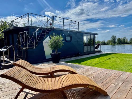 Baambrugse Zuwe Boat Rental | NEW - Little Asia - Stunning Boathouse on a lake Near Amsterdam with Sauna